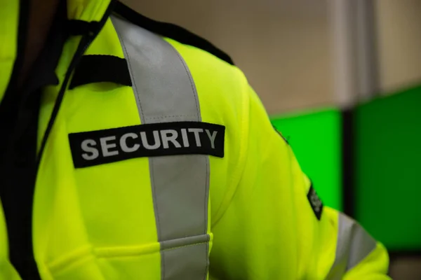 Security team watching over CCTV surveillance monitors.