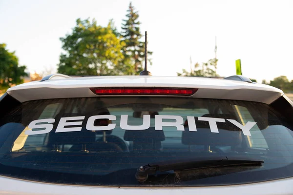 Security car patrolling streets before sunset