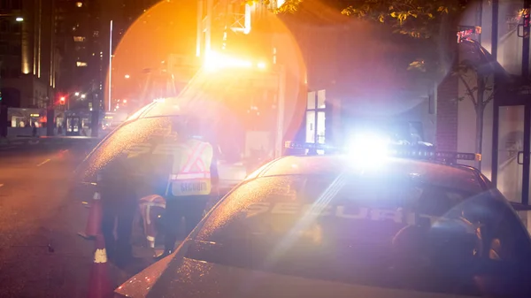 Security car patroling at construction site at night  city