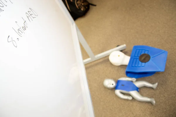 Dummies on the floor for CPR first aid training