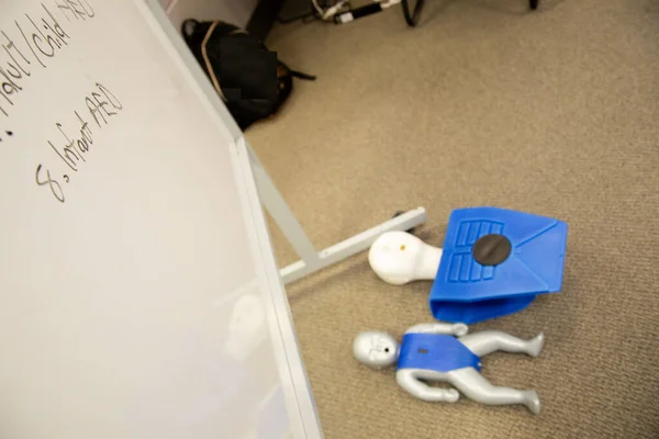 Dummies on the floor for CPR first aid training
