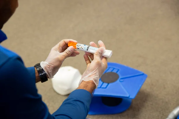 Staff training to inject an epinephrine as first aid
