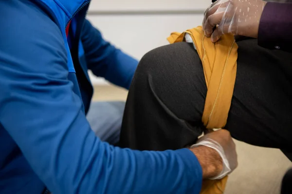 First aid training to treat a stab wound by fixing the object.
