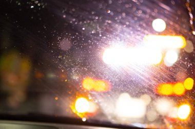 Security guard patroling at construction site at night  city