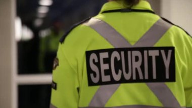 Security guard is watching over the city lights 