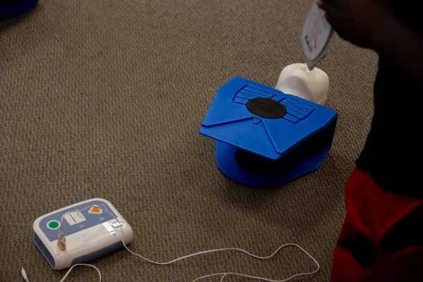 Staff training for CPR first aid with the AED.