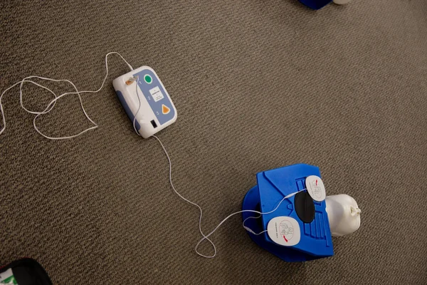 Staff training for CPR first aid with the AED.