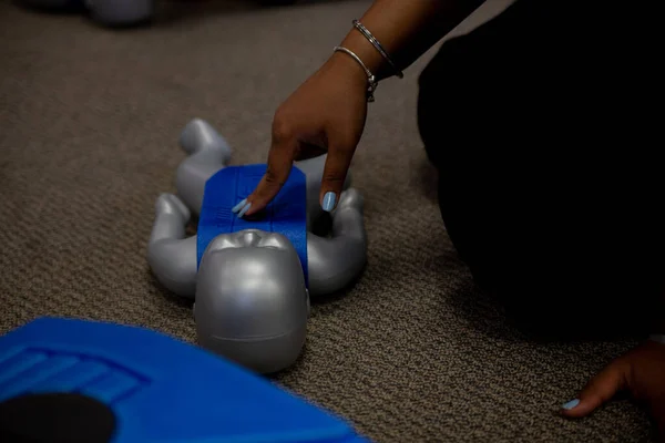 Staff training for CPR first aid with the AED.