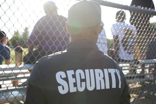 Security guard patrolling soccer stadium