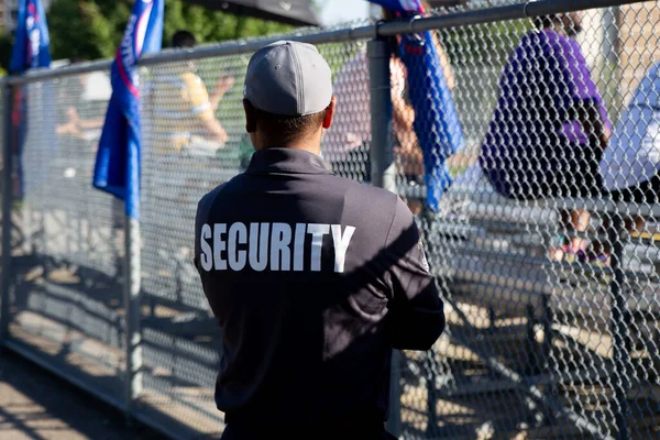 Security guard patrolling soccer stadium