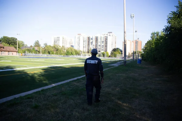 Security guard patrolling soccer stadium