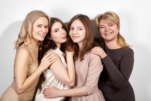 Happy Family of Mother with Three Daughters on Light Grey Background. Fashion Style Studio Portrait. — Stock Photo, Image