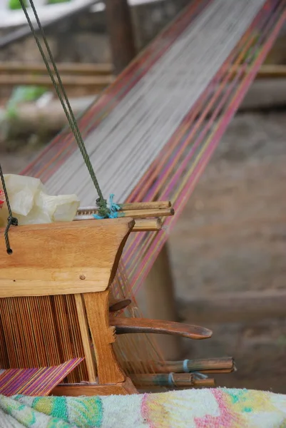 Traditional Loas weaving loom in textile weaving village on the river. High quality photo.