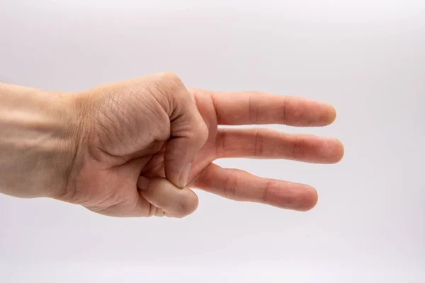 hand with three fingers out of man on white background in light box