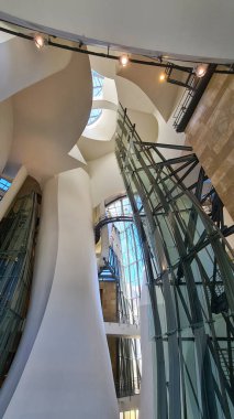 Design of metal structure of modern interior architecture with glass elements.