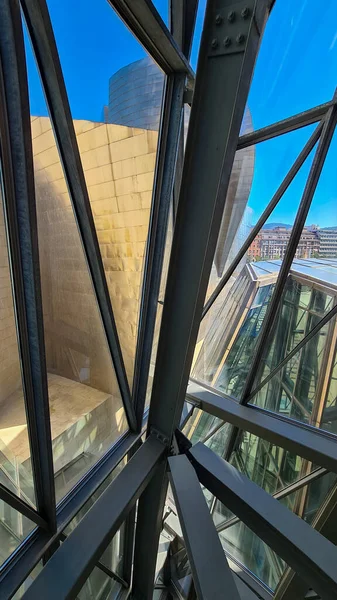 Design of metal structure of modern interior architecture with glass elements.