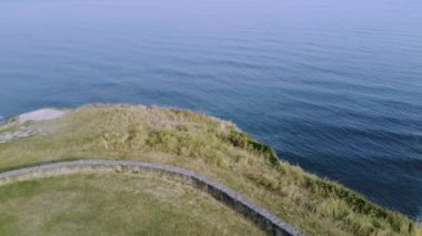 drone aerial view of the coast of the basque country with sunny summer day.