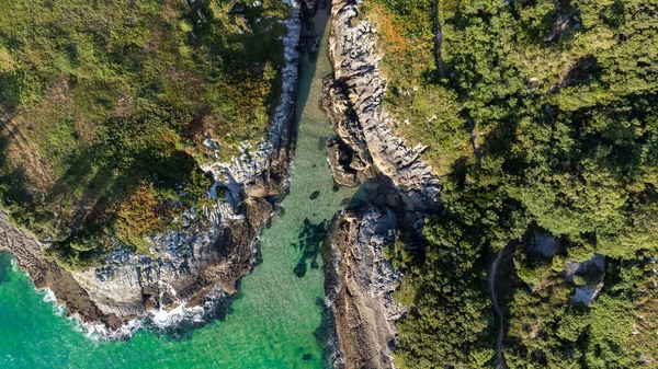 drone aerial view of the cantabric sea coast. Cliff on the coast with turquoise sea on a sunny summer day.