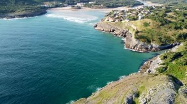 aerial view with drone of the cantabrian coast with the sea entering and the village in the background with the beach on a sunny day.