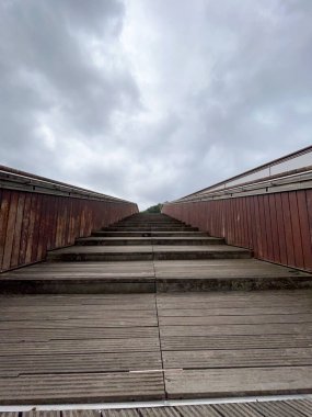 modern wooden stairs on a cloudy day in bilbao