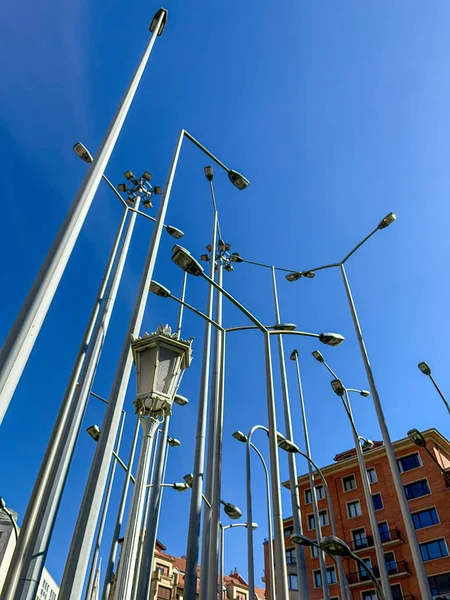 set of modern and antique lampposts indicating sustainable energy on a sunny day