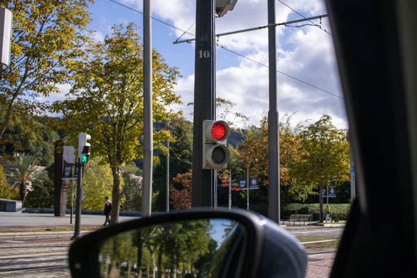 Red light from a stopped car on a cloudy day