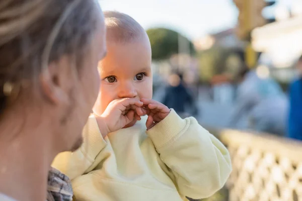 Blurred man looking at baby girl outdoors — Stock Photo