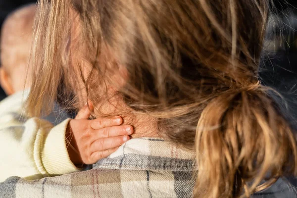 Blurred baby touching dad outdoors — Stock Photo