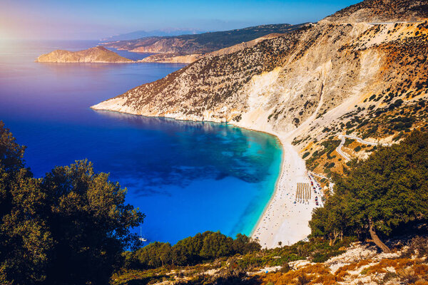 Aerial drone view of iconic turquoise and sapphire bay and beach of Myrtos, Kefalonia (Cephalonia) island, Ionian, Greece. Myrtos beach, Kefalonia island, Greece. Beautiful view of Myrtos beach.