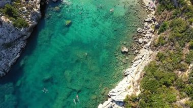 Porto Timoni is an amazing beautiful double beach in Corfu, Greece. Porto Timoni beach at Afionas is a paradise double beach with crystal clear azure water in Corfu, Ionian island, Greece, Europe
