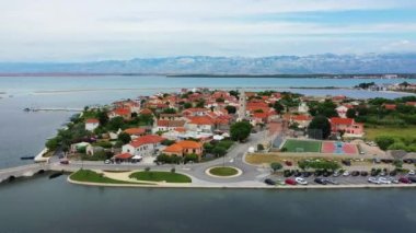 Historic town of Nin laguna aerial view with Velebit mountain background, Dalmatia region of Croatia. Aerial view of the famous Nin lagoon and medieval in Croatia