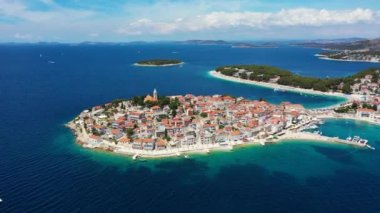 Aerial view of Primosten old town on the islet, Dalmatia, Croatia. Primosten, Sibenik Knin County, Croatia. Resort town on the Adriatic coast. Aerial view of adriatic town Primosten, Croatia