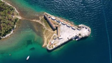 Aerial shot of St. Nicholas Fortress near Sibenik in Croatia. Old St. Nicholas fortress at Sibenik bay entrance, Dalmatia, Croatia, drone aerial shot of beautiful blue coastline seascape