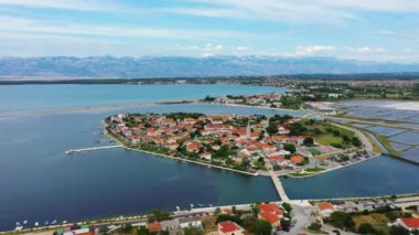 Historic town of Nin laguna aerial view with Velebit mountain background, Dalmatia region of Croatia. Aerial view of the famous Nin lagoon and medieval in Croatia