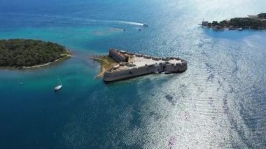 Aerial shot of St. Nicholas Fortress near Sibenik in Croatia. Old St. Nicholas fortress at Sibenik bay entrance, Dalmatia, Croatia, drone aerial shot of beautiful blue coastline seascape