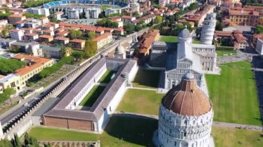 Pisa Cathedral and the Leaning Tower in a sunny day in Pisa, Italy. Pisa Cathedral with Leaning Tower of Pisa on Piazza dei Miracoli in Pisa, Tuscany, Italy.