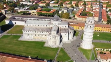 Pisa Cathedral and the Leaning Tower in a sunny day in Pisa, Italy. Pisa Cathedral with Leaning Tower of Pisa on Piazza dei Miracoli in Pisa, Tuscany, Italy.