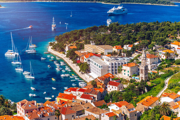 View at amazing archipelago with boats in front of town Hvar, Croatia. Harbor of old Adriatic island town Hvar. Popular touristic destination of Croatia. Amazing Hvar city on Hvar island, Croatia. 