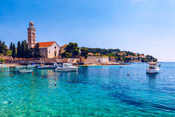 View at amazing archipelago with boats in front of town Hvar, Croatia. Harbor of old Adriatic island town Hvar. Popular touristic destination of Croatia. Amazing Hvar city on Hvar island, Croatia. 