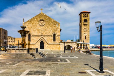 Medieval arched street in the old town of Rhodes, Greece. Rhodes old town in Rhodes island in Greece. Historical streets of old town Rhodes with flowers in Rhodes, Dodecanese, Greece