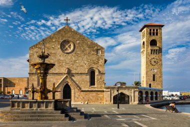 Medieval arched street in the old town of Rhodes, Greece. Rhodes old town in Rhodes island in Greece. Historical streets of old town Rhodes with flowers in Rhodes, Dodecanese, Greece