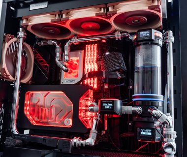 Prague, Czech Republic - 21 July 2021: Close-up of high performance Desktop PC and water cooling system with multicolored LED RGB light show status on working, interior on Computer PC Case and DIY