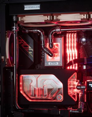 Prague, Czech Republic - 21 July 2021: Close-up of high performance Desktop PC and water cooling system with multicolored LED RGB light show status on working, interior on Computer PC Case and DIY