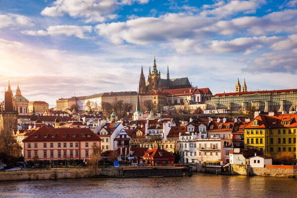 Prague Castle, Charles Bridge and boats on the Vltava river. View of Hradcany Prague Castle, Charles Bridge and a boats on the Vltava river in the capital of the Czechia. 