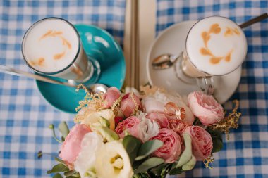 Beautiful wedding collage with wedding flowers and rings