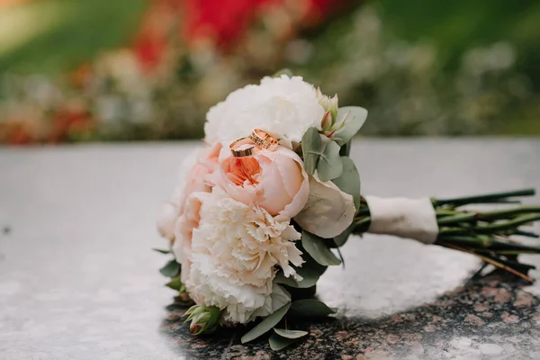 Beautiful wedding collage with wedding flowers and rings