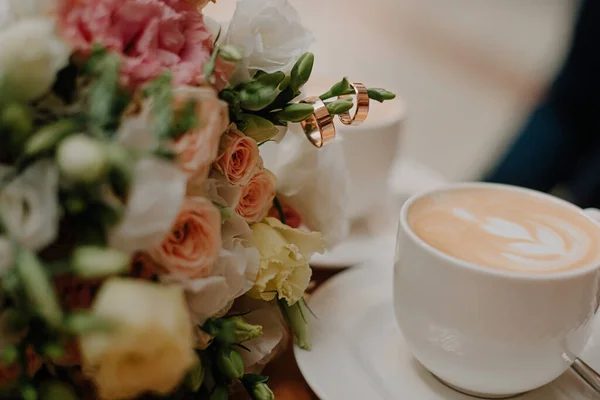 Beautiful wedding collage with wedding flowers and rings