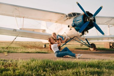 Mom and daughter have fun at the airport
