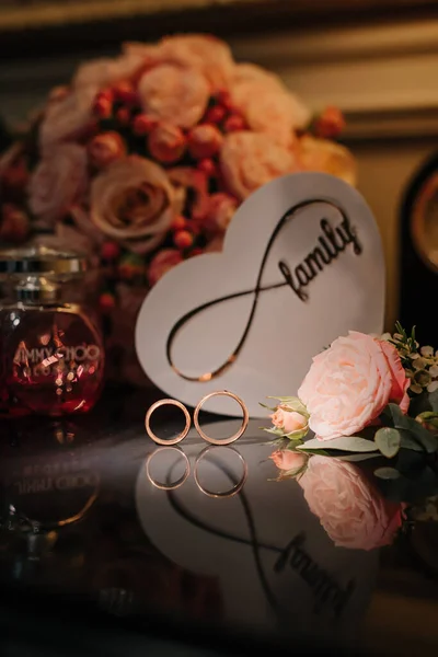 Beautiful wedding collage with wedding flowers and rings