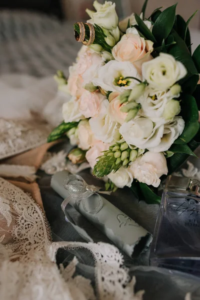 Beautiful wedding collage with wedding flowers and rings